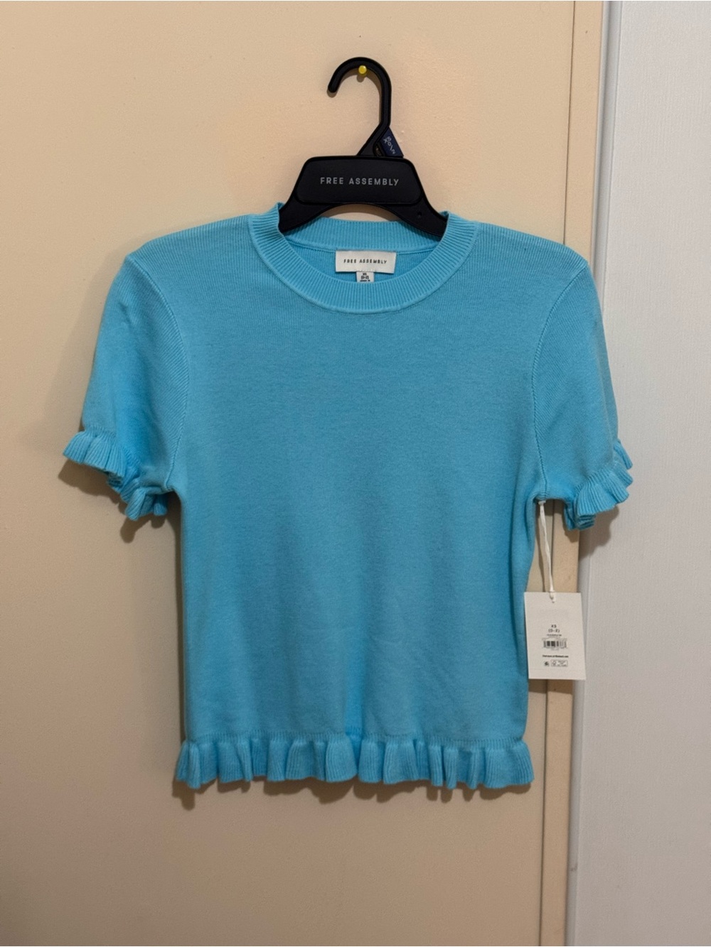 Free Assembly Women's Short Sleeve Ruffle Hem Tee in Light Blue